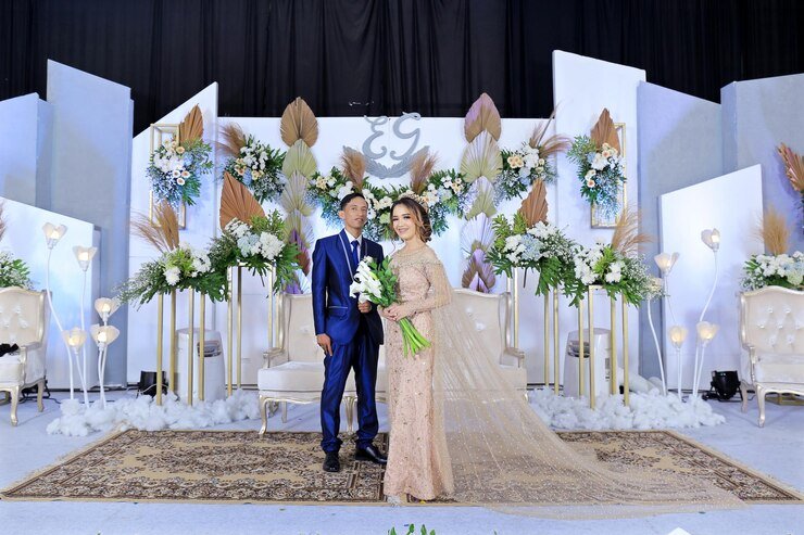 couple-marriage-with-wedding-backdrop-flower-wedding-decoration_1048944-21285620